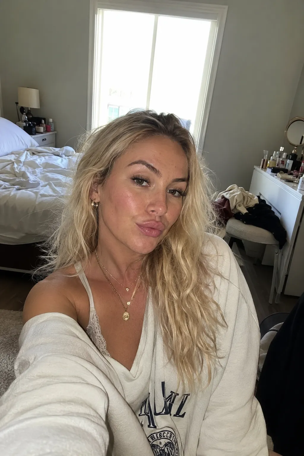 Messy-bedroom selfie.